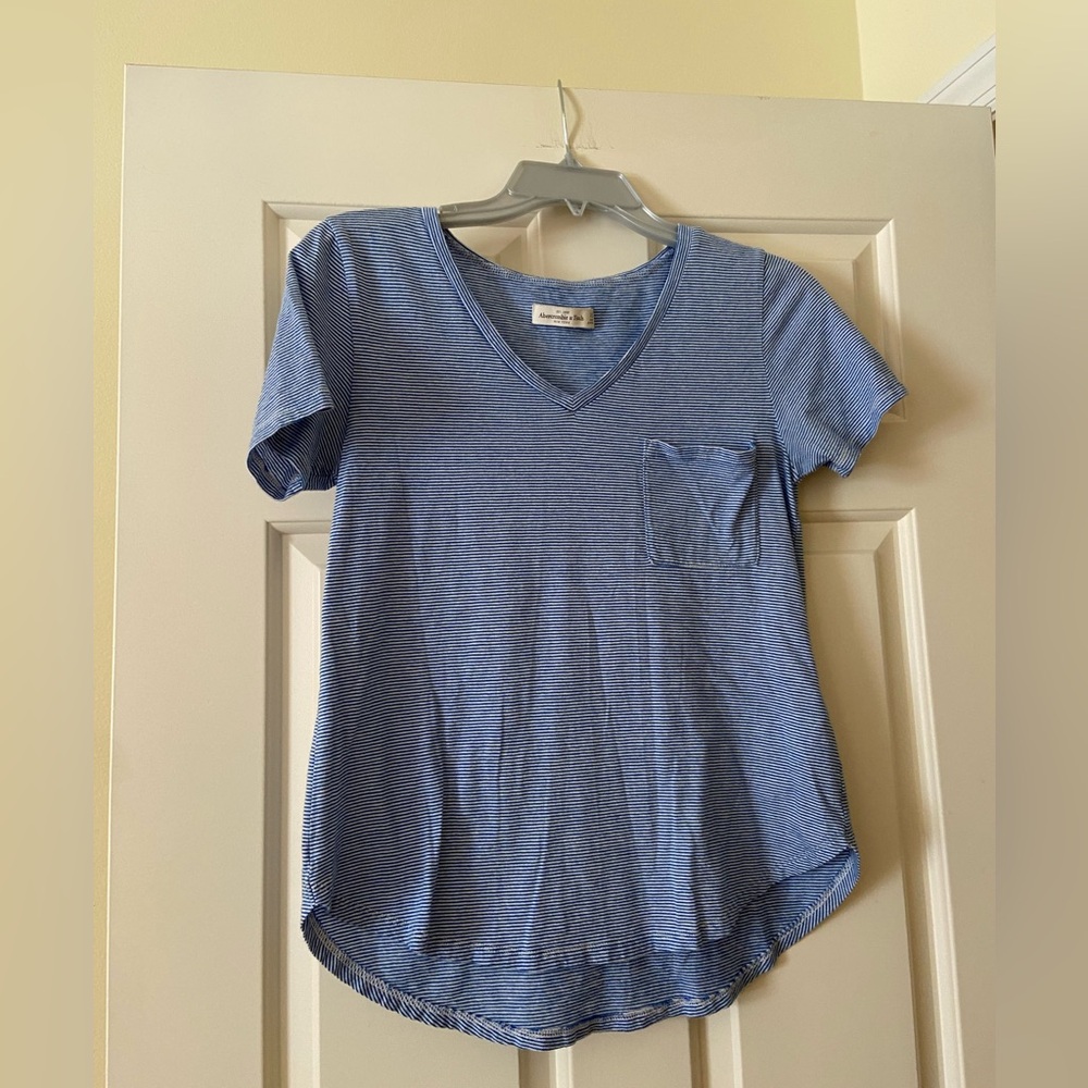 Blue and white striped v neck short sleeve shirt with front pocket